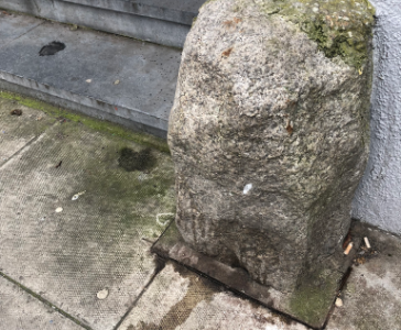 A truly strange stone cross outside an optician's on the corner of Kevin Street and Bride Street