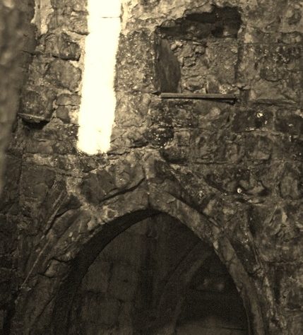 Ballyegnybeg Castle: Sealed up entrance with arched entrance to lobby and slit window above. | Joseph Lennon