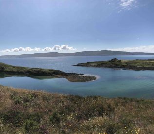 Lonehort Harbour, Bere Island viewed from the public road which overlooks it. | Helen Riddell