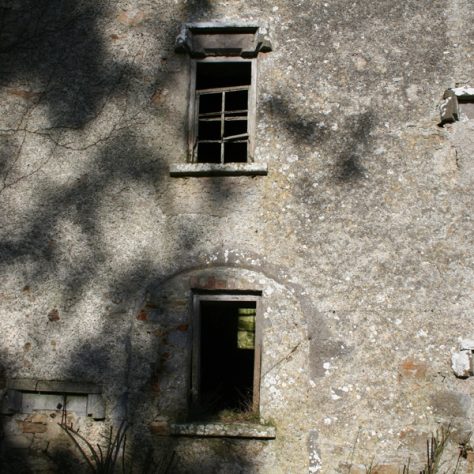Ballyvenoge Castle: Hood-moulded windows; and another built into an older round doorway | Joseph Lennon